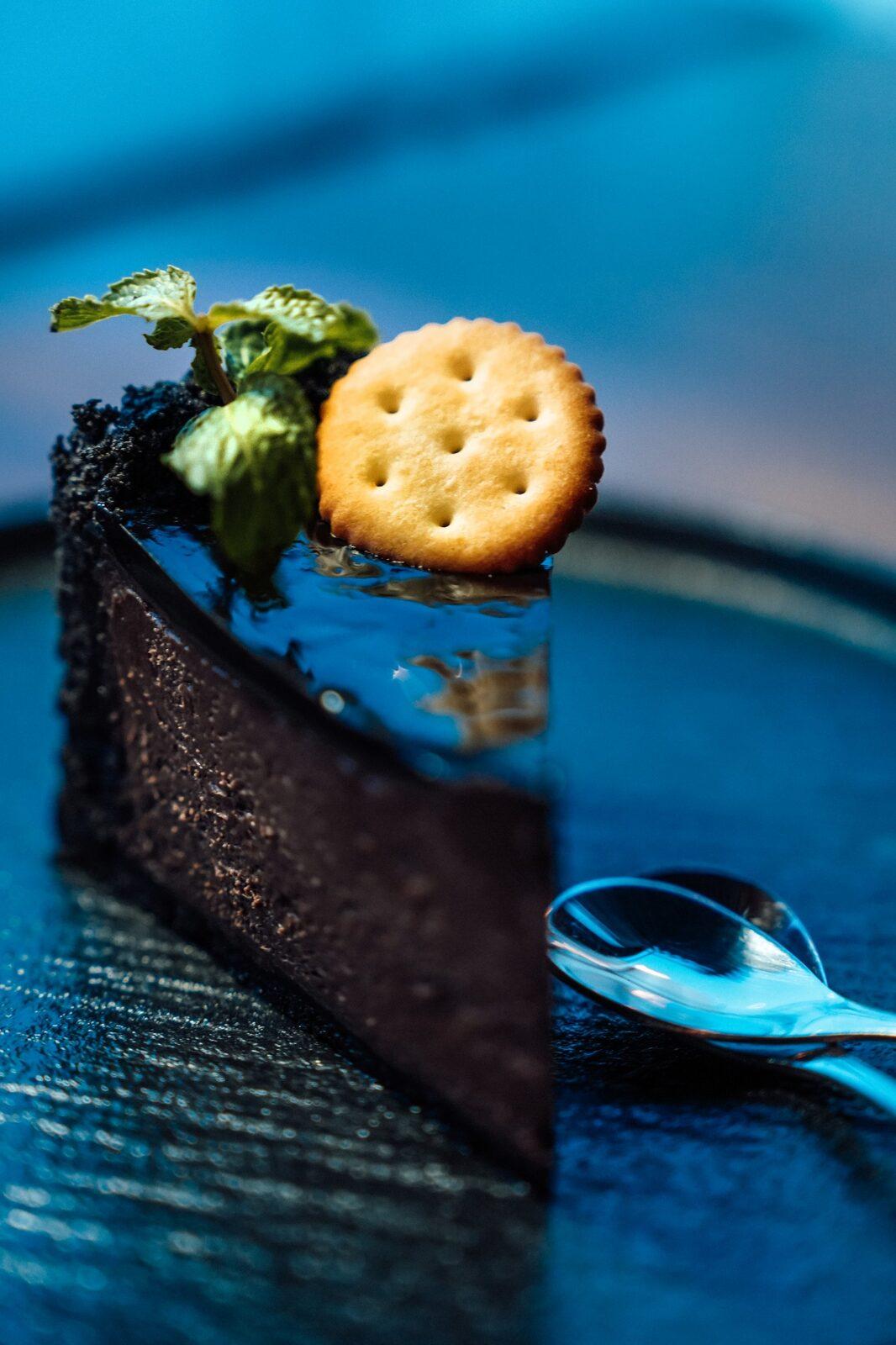 Chocolate tart with mint and a cracker