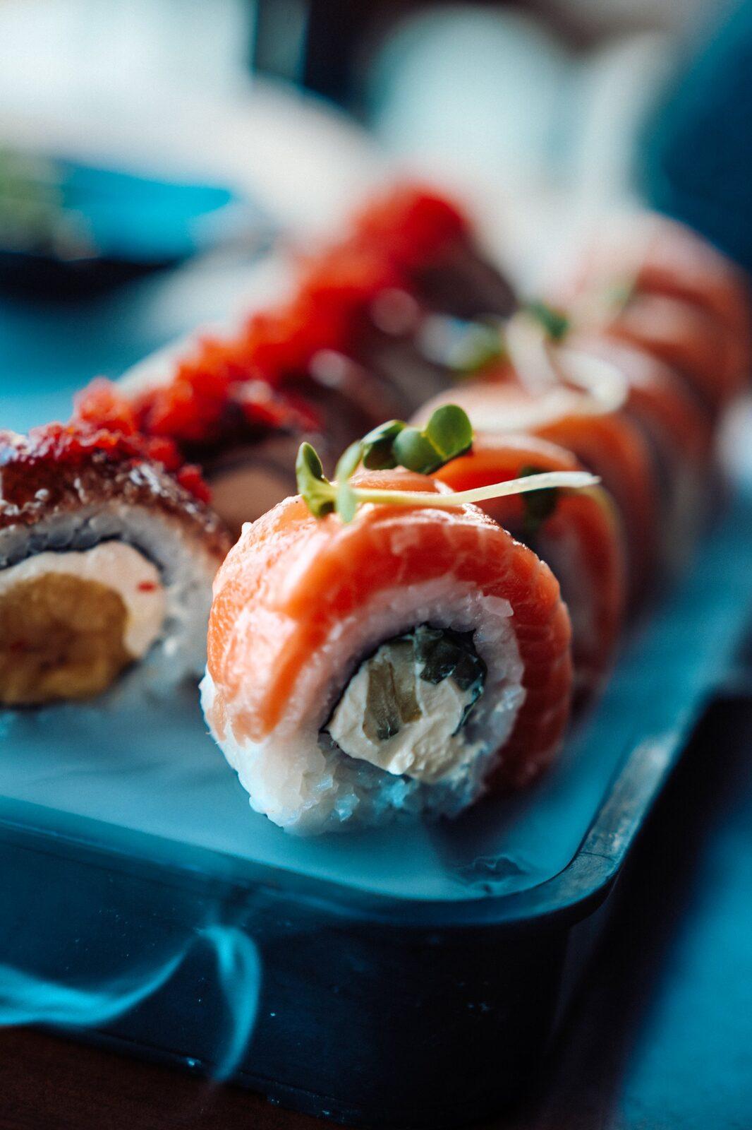 Salmon roll with cream cheese and microgreens